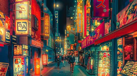 A City Street Filled With Lots Of Neon Signs