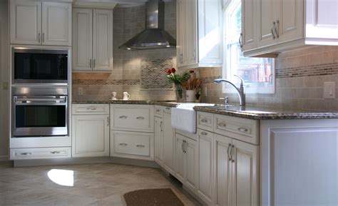 White raised panel in stock kitchen cabinets. White Raised Panel Kitchen Cabinets With A Linen Brushed Finish, Canterbury Cambria Quartz ...