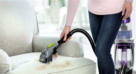 Using your steam cleaner's upholstery attachment, apply your steamed water and cleaning solution to your furniture in long, even strokes. Best Upholstery Steam Cleaner - Liquid Image