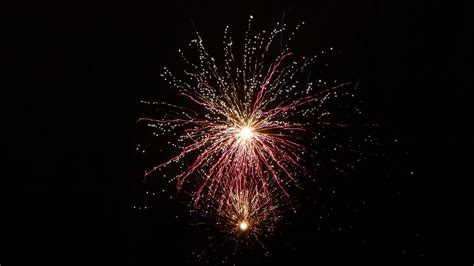 Download Wallpaper 1366x768 Salute Fireworks Sky Glitter Tablet