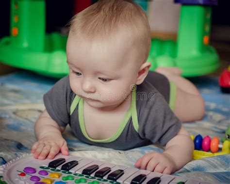 Baby Boy Playing With Piano Toy Stock Photo Image Of Musical