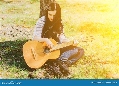 Beautiful Woman Playing An Acoustic Guitar Outdoor Stock Image Image