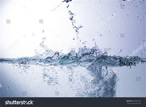 Bursts Splashing Water Droplets On Solid Stock Photo 489255457