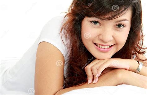 asian woman lying on the bed stock image image of girl lying 22568009