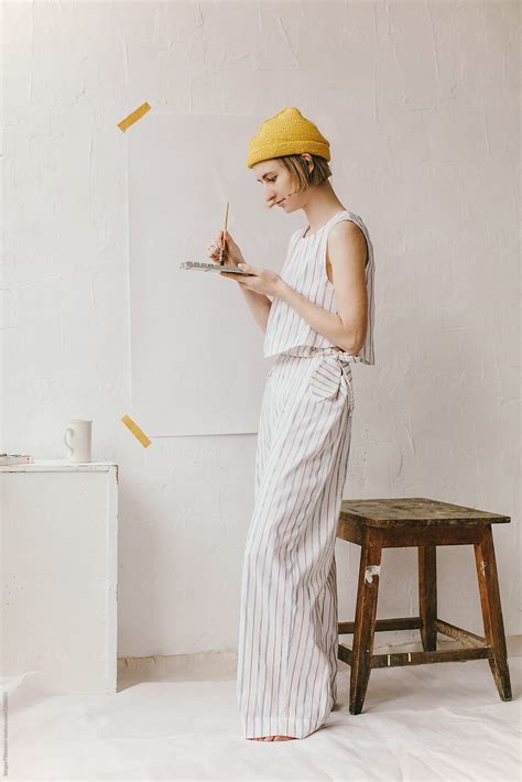 Woman Artist In Her Studio Getting Ready To Paint By Stocksy Contributor Sergey Filimonov
