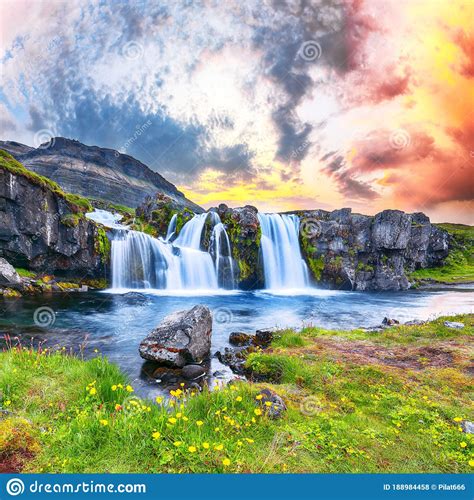 Dramatic View On Kirkjufellsfoss Waterfall Near Kirkjufell Mountain At