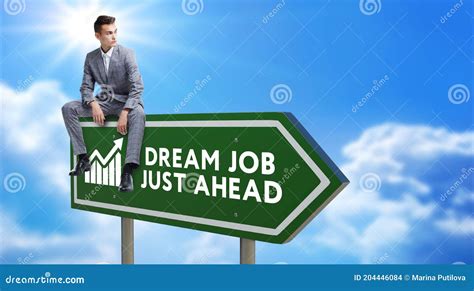 Dream Job Green Road Sign Against Clouds And Sunburst Stock Photo