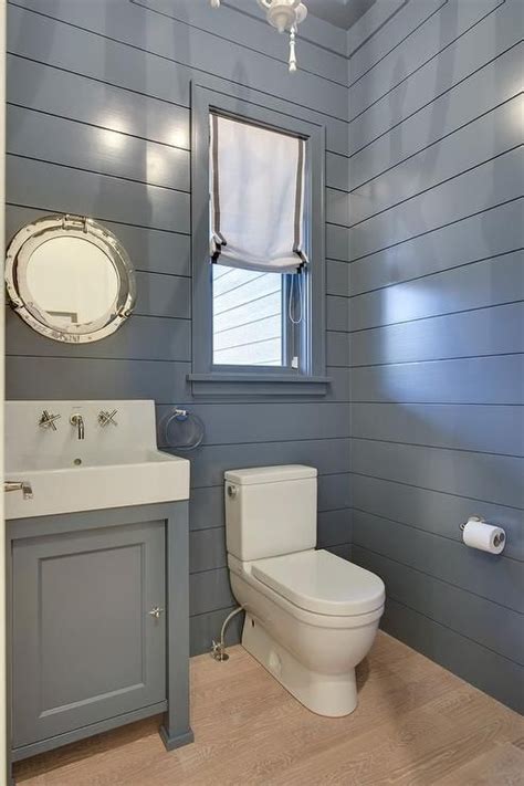 Blue Cottage Powder Room Boasts Blond Oak Wood Floors Framed By Blue