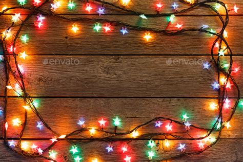 Christmas Lights Border On Wood Background Stock Photo By