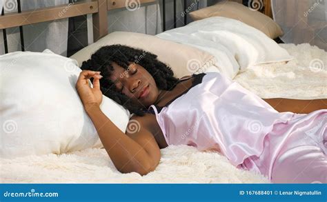 Pretty Young Woman In Pajamas Lies In Bed Takes Smartphone Stock Image Image Of Afroamerican