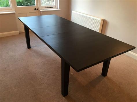 ikea stornas extendable dining table brown black seats