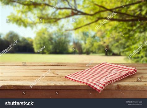 Empty Wooden Table With Tablecloth Over Autumn Nature Park Background