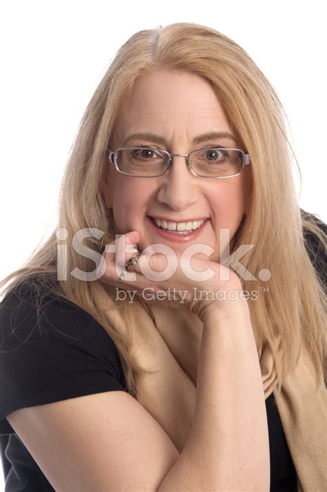 Laughing Mature Woman With Chin On Palm Stock Photo Royalty Free FreeImages