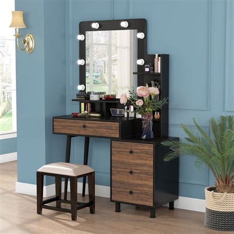 Accented with tasteful geometric lines, this lighted makeup vanity lends a glamorous flair that blends well with any modern décor. Makeup Vanity Dressing Table with Lighted Mirror and 3 ...