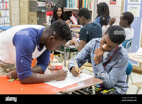 High School Students Working Together In The Classroom Stock Photo Alamy