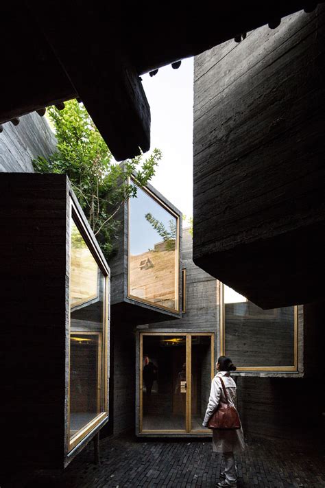 Micro Hostel With Tiny Concrete Rooms Installed By Zhang Ke In Old
