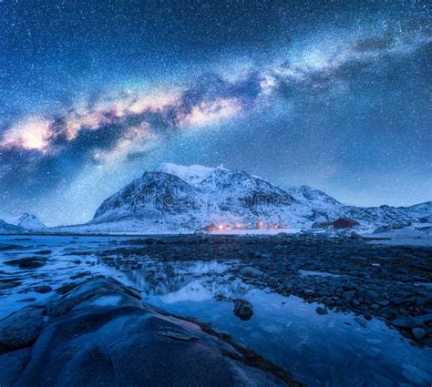 Milky Way Above Frozen Sea Coast And Snow Covered Mountains Stock Image