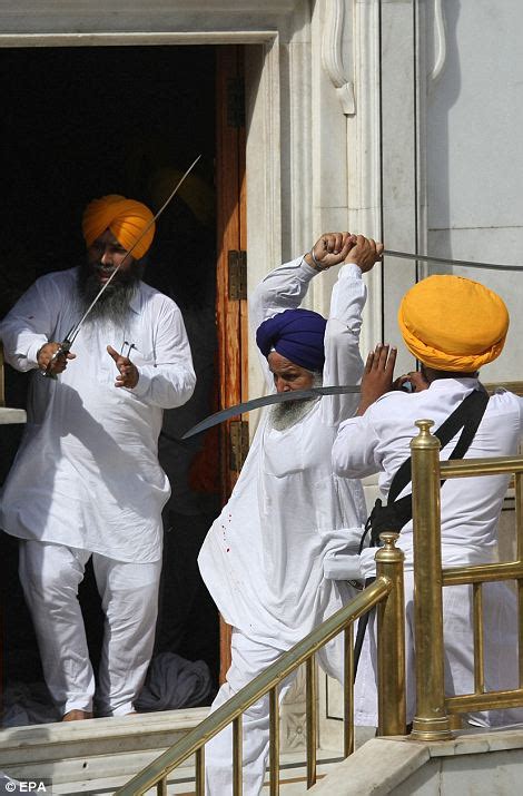 sword wielding sikhs clash at india s golden temple during prayers daily mail online
