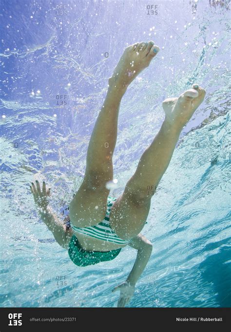 Teenage Girl In A Bathing Suit Swimming In A Pool Stock Photo Offset
