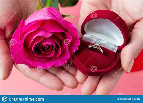 Ring In Heart Shaped Box And Flower In Hands Valentine S Day T