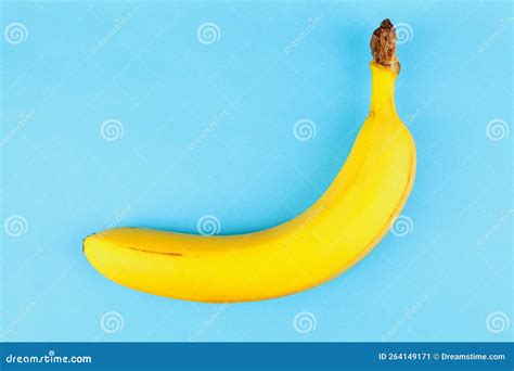 Single Yellow Banana On Sky Blue Background Stock Image Image Of