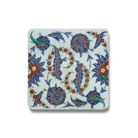 An Iznik Polychrome Pottery Tile With Saz Leaves And Floral Blossoms