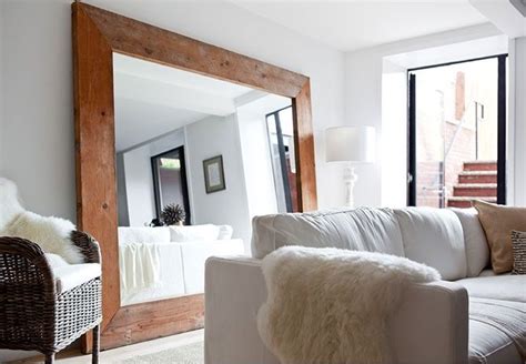 Oversized Mirror With Wooden Frame How To Make A Room Feel Roomier