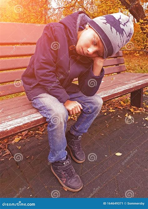 Sad Boy Sitting On Bench Alone Outdoor Stock Image Image Of Outdoor