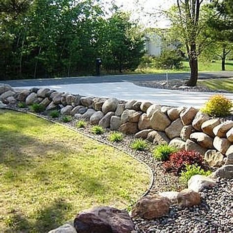 How To Build A Boulder Rock Retaining Wall Hunker Landscaping