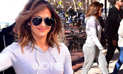 jennifer lopez highlights pert posterior and enviable curves in grey tracksuit daily mail online