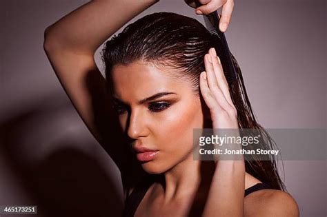 wet hair combing photos and premium high res pictures getty images