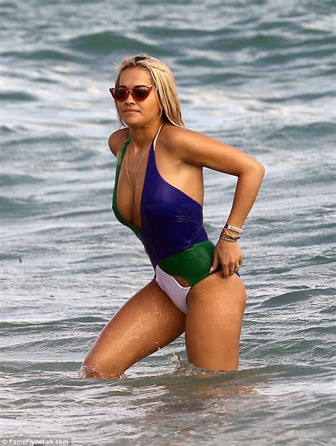 Rita Ora Shows In A Dangerously Low Cut Swimsuit As She Hits The Miami