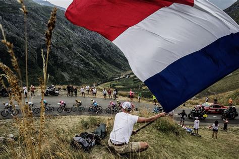 A spectator waits for the pack during the first stage of the tour de france cycling race over 197.8 kilometers (122.9 miles) with start in brest and finish in landerneau, france, saturday, june 26, 2021. Cyclisme. Les dates du Tour de France 2021 modifiées