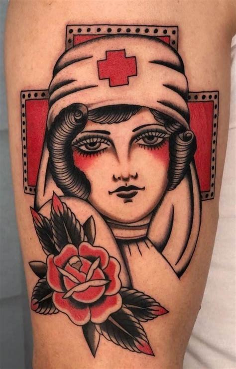 A Womans Arm With A Red Cross On It And A Rose In The Center