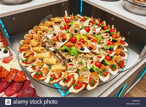 A large gallery of mini food ideas for weddings, parties, and other events; Variety of colorful tasty arranged party finger food - cold buffet Stock Photo: 229695396 - Alamy