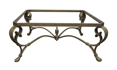 A wrought iron coffee table most often has a base fashioned from the metal with a glass tabletop. Wrought Iron Coffee Table Base | Olde Good Things