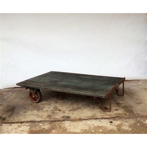 Once you have decided on a light or dark finish, the hardware will be removed and sandblasted. Vintage Railroad Cart Coffee Table | Chairish