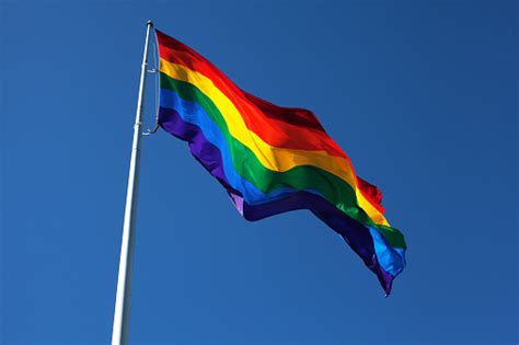 Rainbow Flag Fluttering In The Sky Stock Photo Download Image Now