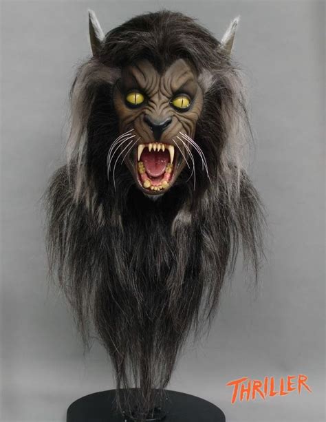 An Animal Head With Yellow Eyes And Long Hair