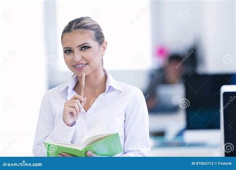 Portrait Of Busy Secretary Looking At Camera Stock Photo Image Of