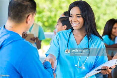 Happy African American Doctor Meeting Patient At Temporary Free Clinic