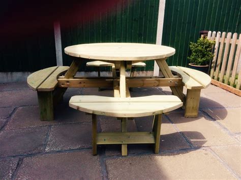 Shop online and in store now. 8-seater round picnic table - wooden garden furniture for ...