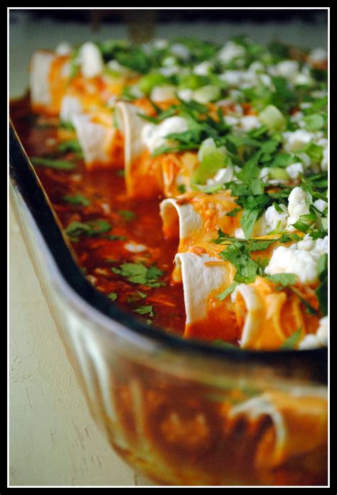 To assemble the enchiladas, dip a tortilla into the sauce then lay on a sheet pan or plate. Buffalo Chicken Enchiladas