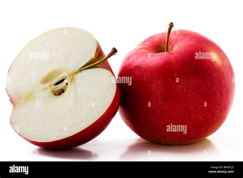 One Red Apple And A Half Isolated On White Background Stock Photo Alamy