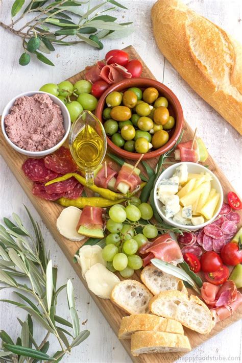 Antipasto can be as simple as cold meats and salami, breads, olives, cheeses, marinated and freshly cooked vegetables to bruschetta, fritters, crostini, frittata and many other dishes. New Years Eve Party Food Ideas - Happy Foods Tube