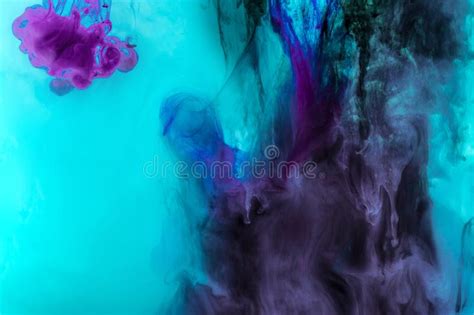 Creative Texture With Turquoise And Purple Swirls Of Paint In Water