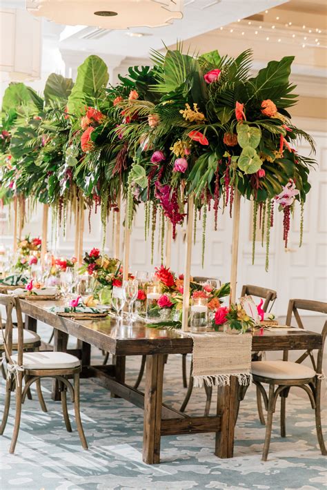 Tropical Garden Wedding Centerpiece With Palm Leaves And Fronds Wood Farm Tables  Gartenlove