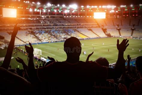 Silhouette Of Fan Celebrating A Goal On Football Match Support Team On