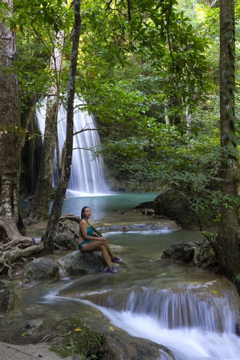 Woman In Blue Swimsuit Sit Look Erawan Waterfall And Natural Stock