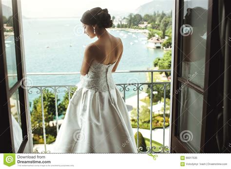 Gorgeous Brunette Bride Posing At Balcony At Sea Resort Hot Stock Image